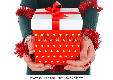 Close-up picture of a woman's hands holding Christmas gift