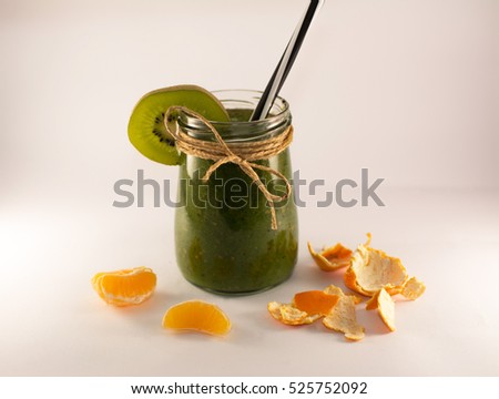 green smoothie from spinach and kiwi on a white background