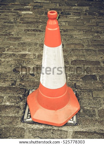 Vintage looking Orange and white traffic cone for roadworks