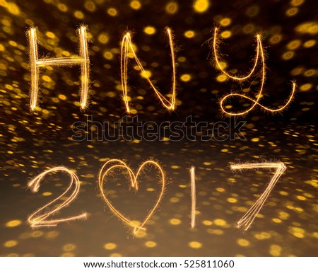 happy new years 2017 fireworks Sparkle alphabet on gold bokeh background. HAPPY NEW YEAR concept.