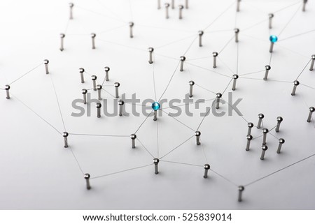 Linking entities. Network, networking, social media, connectivity, internet communication abstract. Web of thin silver wires on white background. Key Person or network hub. Royalty-Free Stock Photo #525839014