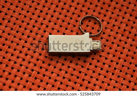 USB flash drive , 64 GB, 3.0 ,on  a braided background