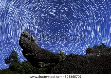star trail over the mountain , night stars for background, stars in the night sky.