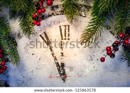Christmas clock and decoration on snow. Happy new year concept