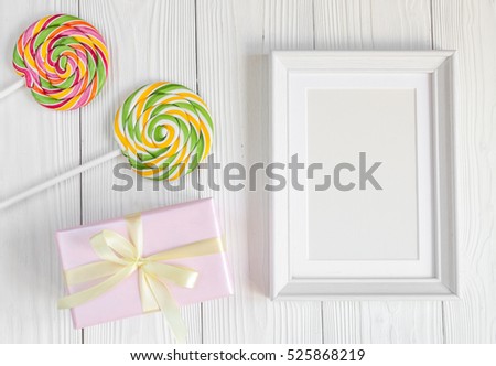 birth of child - blank picture frame on wooden background