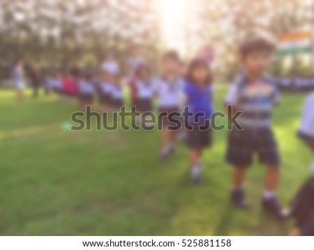blur kids and teacher in the playground for background usage.