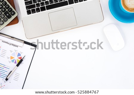 Modern White office desk table with laptop computer,mouse,pen,calculator,leather notebook,analysis chart or graph and cup of coffee.Top view with copy space.Working desk table concept.