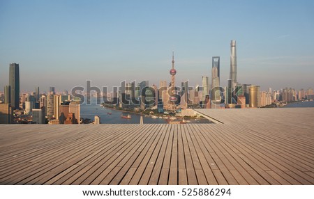 Aerial photography bird view at Empty wood floor with city landmark buildings background at Shanghai bund panorama Skyline