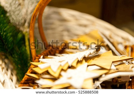 Christmas Fir Tree and stars Toys Old wooden in the basket Burning Candles, Boxes, Balls, Pine Cones, Walnuts, Branchesin the background other decorations  garlands. copy space.