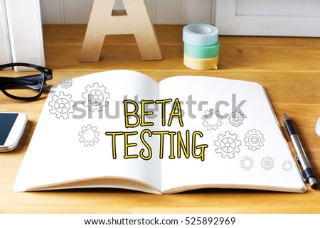Beta Testing concept with notebook on wooden desk 
