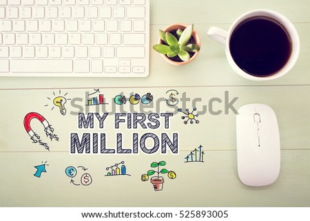 My First Million concept with workstation on a light green wooden desk