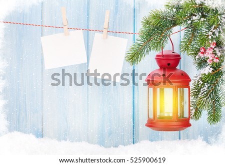 Christmas candle lantern and blank photo frames