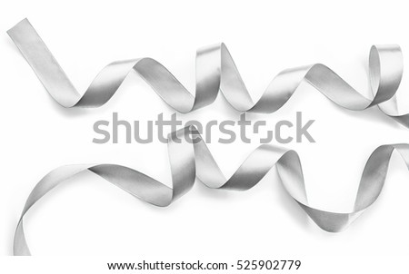Silver ribbon bow in bright silver white grey color isolated on white background with clipping path for holiday and party greeting card design decoration element
 Royalty-Free Stock Photo #525902779