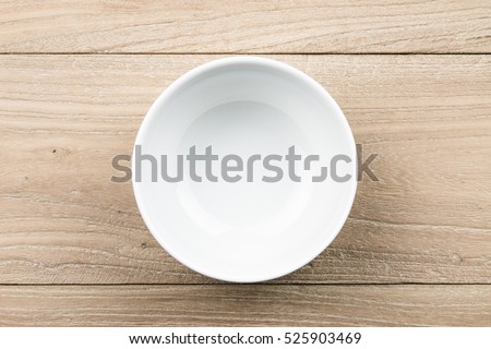Empty bowl in the wood Royalty-Free Stock Photo #525903469