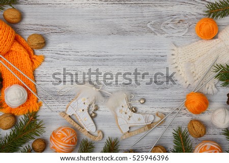 Christmas frame ornaments, Christmas trees, wooden skates, scarves on a white background