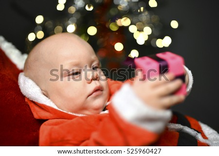 little baby celebrates Christmas.
