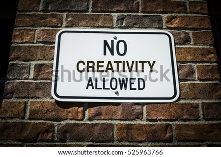 No Creativity Allowed Sign on a Brick Wall