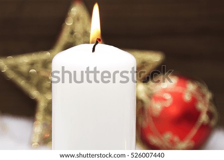 Christmas card with candles on snow
