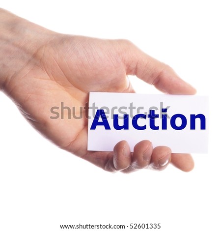 buy or sell on auction concept with hand holding paper