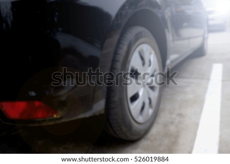 Abstract blur cars parking with bokeh light Background for use as Background