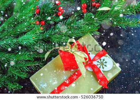 Christmas background with gift box and multicolored ornaments. Christmas background top view copy space.tinted