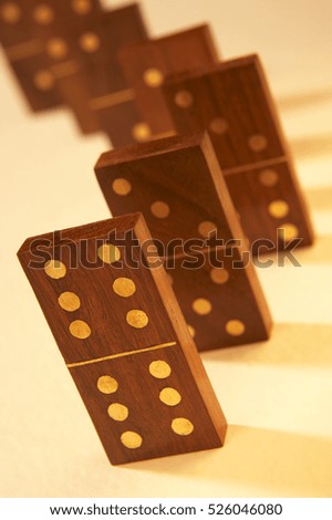 ROW OF ANTIQUE WOOD AND BRASS DOMINOES