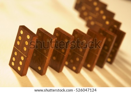 ROW OF ANTIQUE WOOD AND BRASS DOMINOES