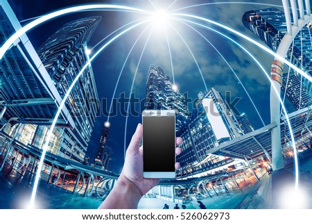 Network and Connection technology and mobile concept with city background Royalty-Free Stock Photo #526062973