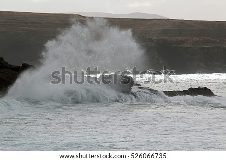 Powerful waves breaking on the rocky shore 2778(2)