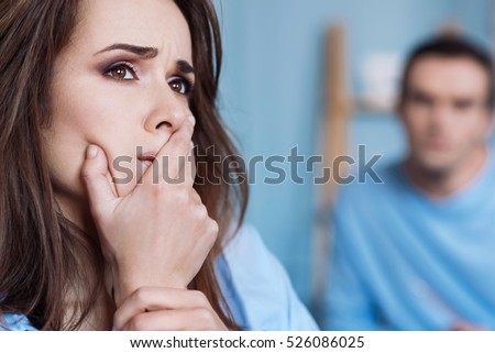 Troubled woman expressing despair Royalty-Free Stock Photo #526086025