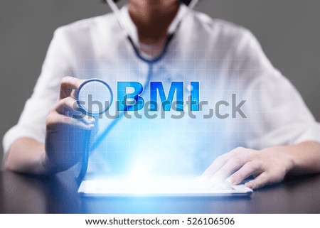 Medical doctor working with modern computer and pressing button bmi. Medical concept.