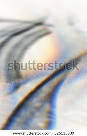 Abstract light projections on a textured surface with light spectrum revealed. Inverted post process. Background