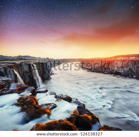 Fantastic views of Selfoss waterfall in the national park Vatnajokull. Iceland. Fantastic starry sky and the milky way.