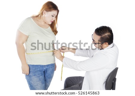 Picture of male doctor examining fat woman, isolated on white background