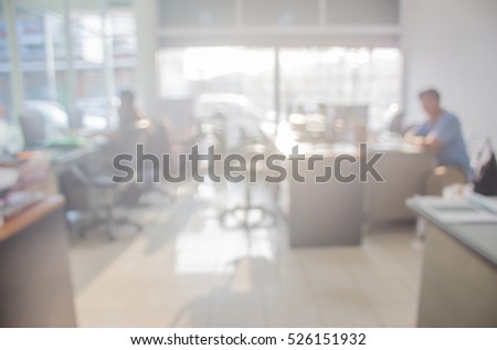 Businessmen blur in the workplace.Table Top And Blur Office of Background.abstract blur background table work in office with computer.Abstract background of office, shallow depth of focus.