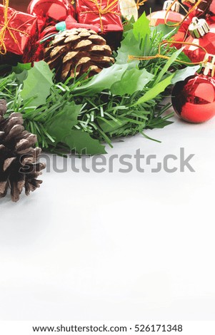 colorful decorative christmas and happy new year ornaments on white fabric background. over light and film tone 