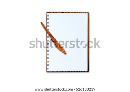 Notepad with ball pen on a white background