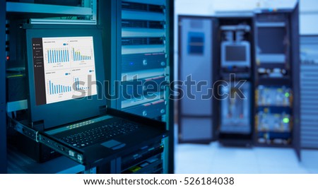 monitor show graph information of network traffic and status of device in server room data center and blur background
