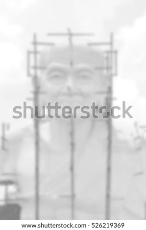 Blurred abstract background of buddha statue under Construction