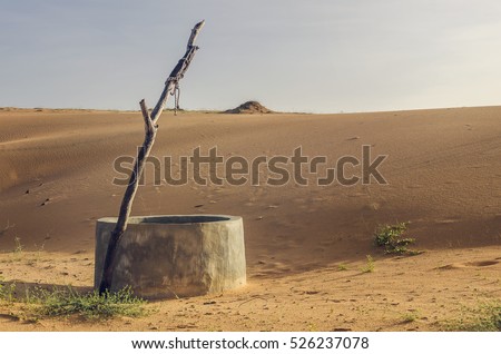 old and abandoned well in the desert. Africa Royalty-Free Stock Photo #526237078
