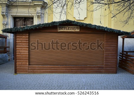 empty and closed wooden christmas gift shop with a Bethlehem sign in winter