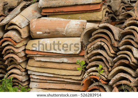 A stack of old roofing tiles