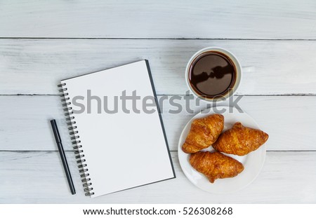 White office desk with coffee and notebook on wooden table. Top view with copy space. Student or business accessories flat lay. Office supplies and gadgets on background. 