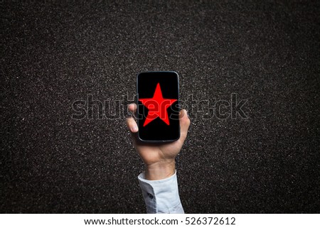 phone on hand and star on screen phone