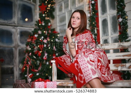 Beautiful girl on Christmas porch