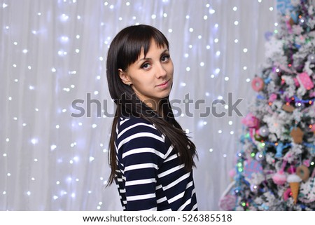 girl near the Christmas tree