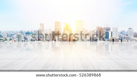 Business concept - Empty marble floor top with panoramic modern cityscape building bird eye aerial view under sunrise and morning blue bright sky of Tokyo, Japan for display or montage product Royalty-Free Stock Photo #526389868