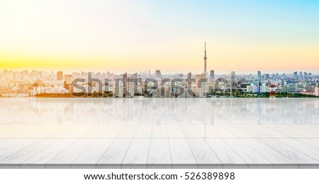 Business concept - Empty marble floor top with panoramic modern cityscape building bird eye aerial view under sunrise and morning blue bright sky of Tokyo skytree, Japan for display or montage product