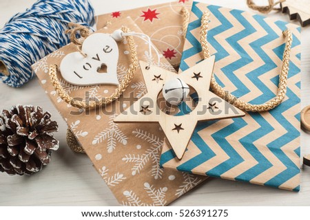 Christmas present packaging, wrapping twine, wooden vintage toys. Modern lifestyle composition in scandinavian style