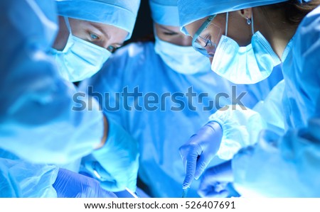 Team surgeon at work on operating in hospital Royalty-Free Stock Photo #526407691